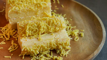 Yellow pasta on stainless steel plate